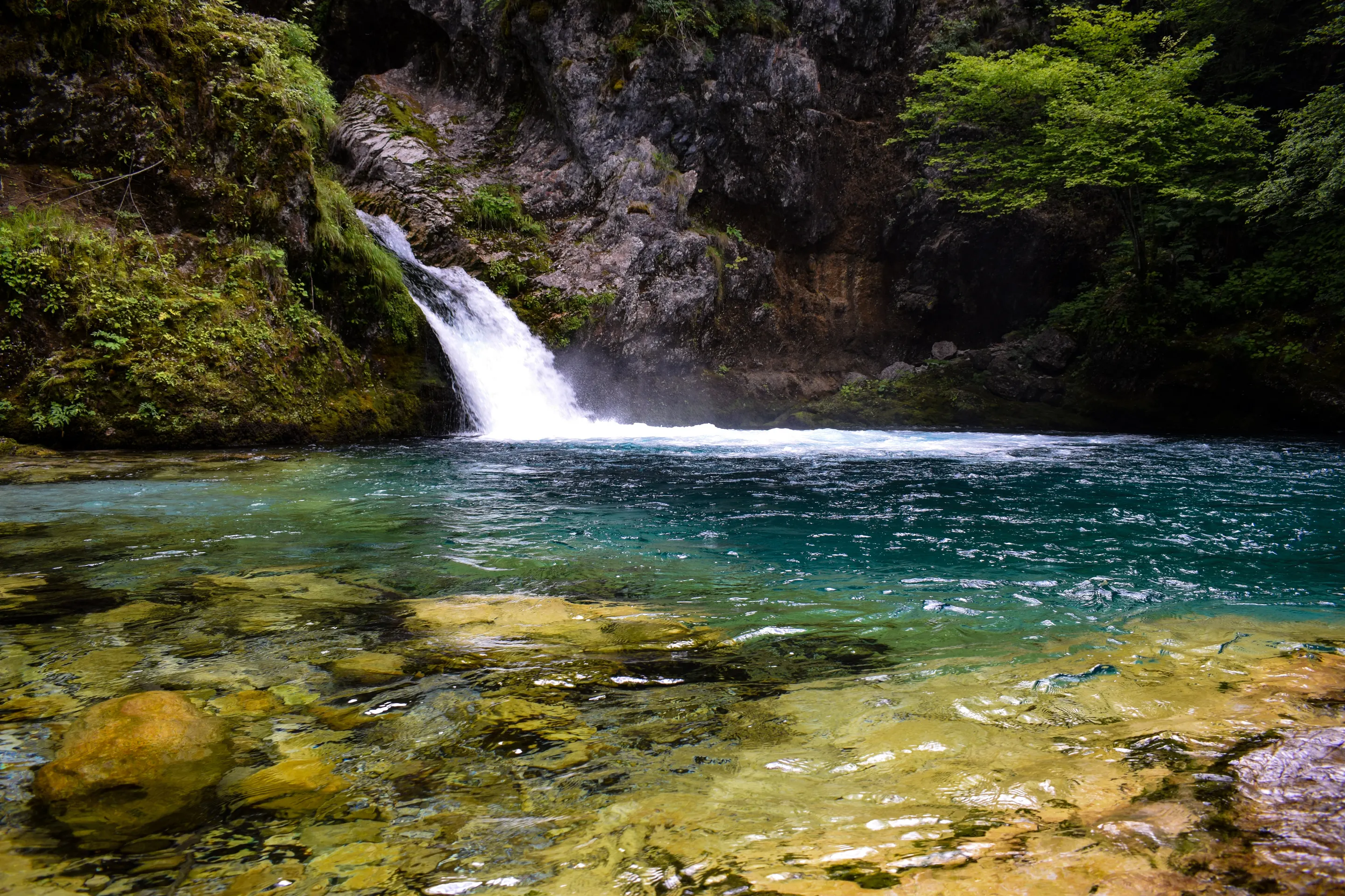 The turquoise pool of the Blue Eye of Theth in northern Albania